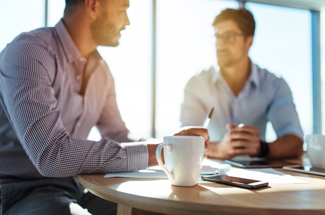 Two men having coffee